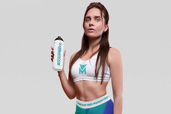 Front View of Athletic Woman Wearing Sportswear with a Bottle Mockup