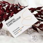 Front View of Business Card Mockup Standing at Angle with Leaf