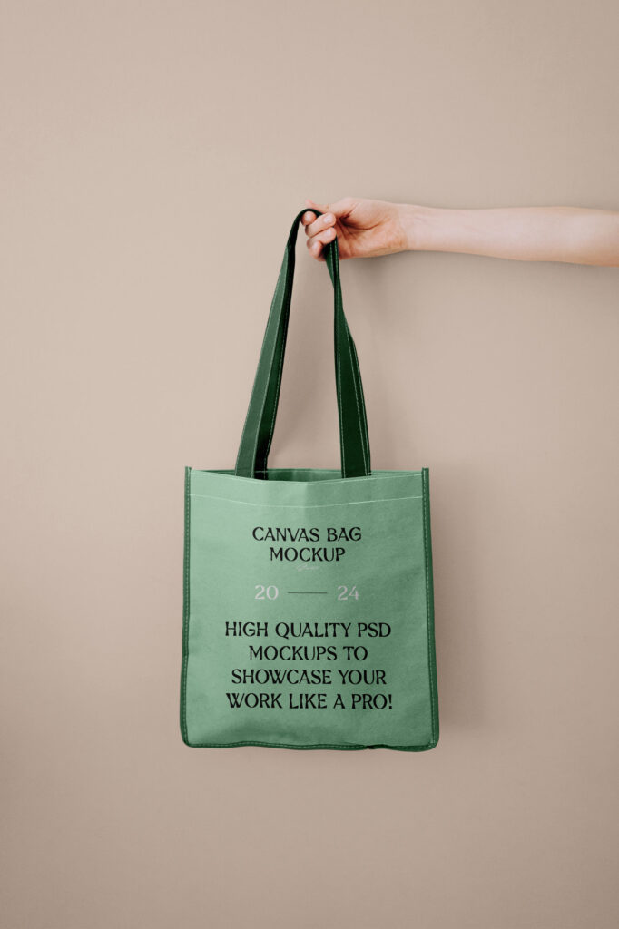 Front View of Canvas Shopping Bag Mockup in Hand