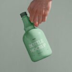 Front View of Ceramic Bottle Mockup in Hand