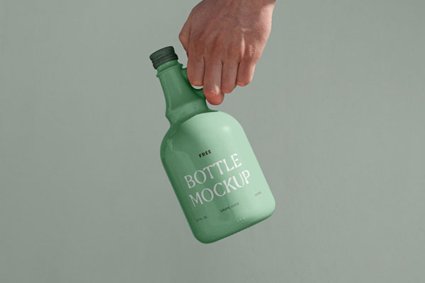 Front View of Ceramic Bottle Mockup in Hand