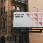 Front View of City Billboard Mockup on Side of Building