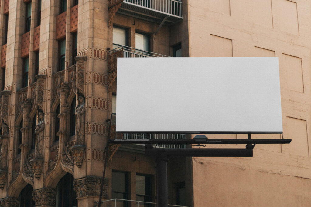 Front View of City Billboard Mockup on Side of Building