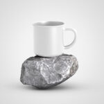Front View of Enamel Mug on Piece of Rock Mockup
