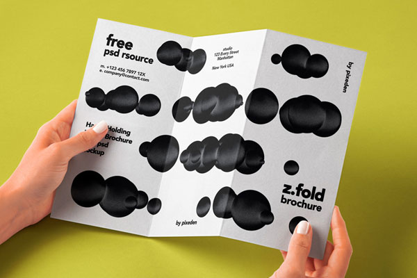 Front View of Hand-holding 3Fold Brochure Mockup
