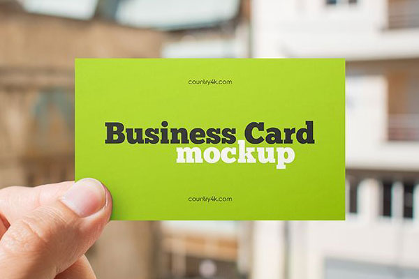 Front View of Hand Holding Business Card Mockup