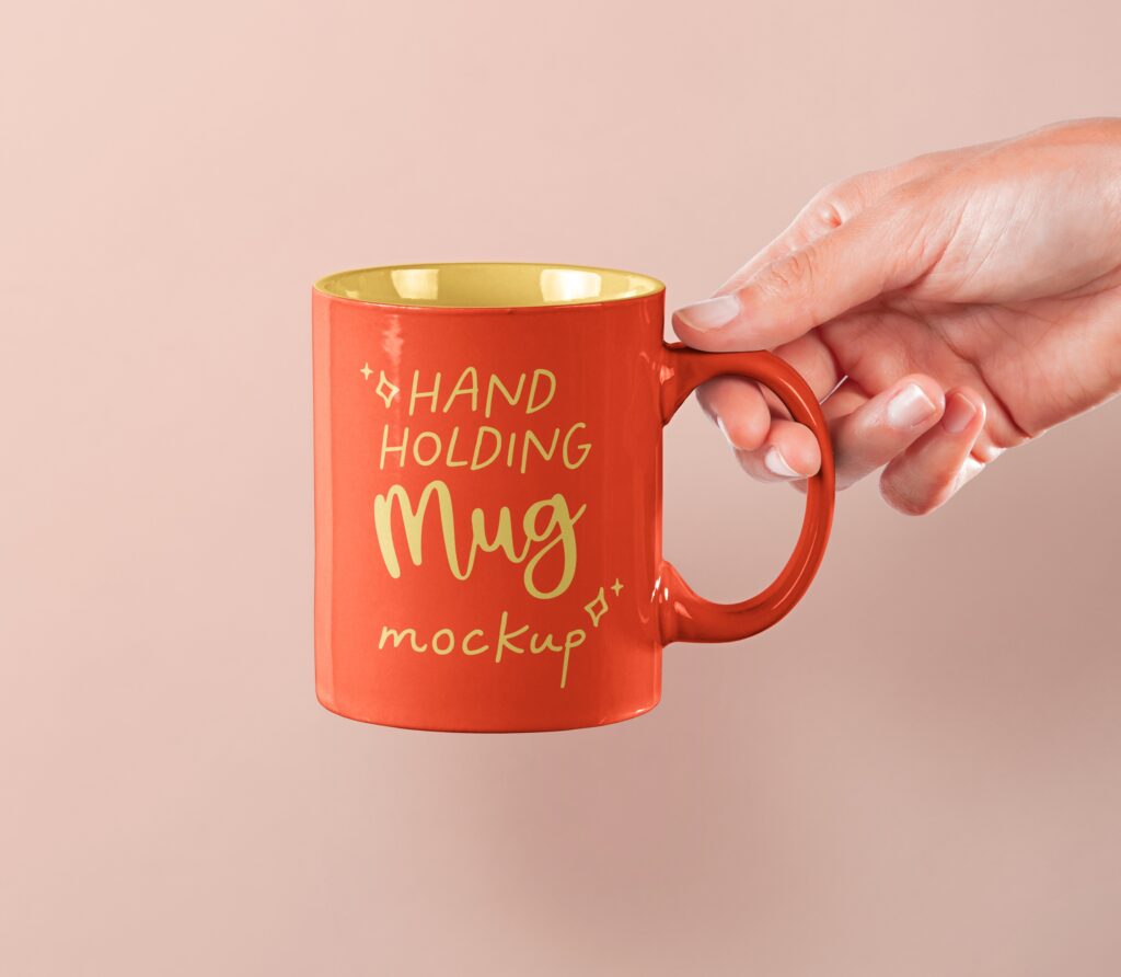 Front View of Hand Holding Mug Mockup