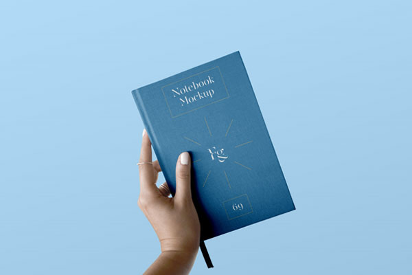 Front View of Hand Holding Notebook Cover Mockup