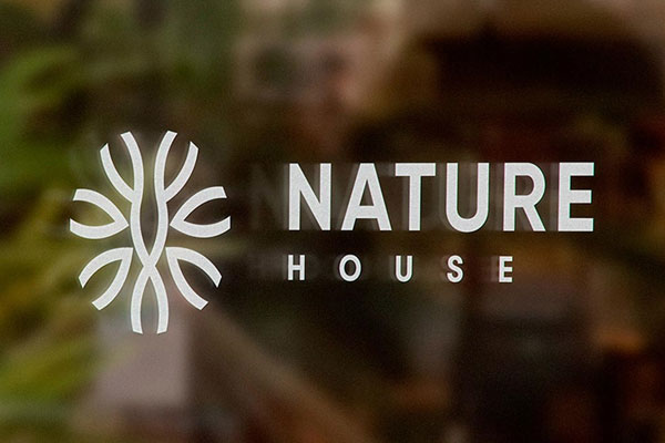 Front View of Logo Sign Mockup on a Shop Window