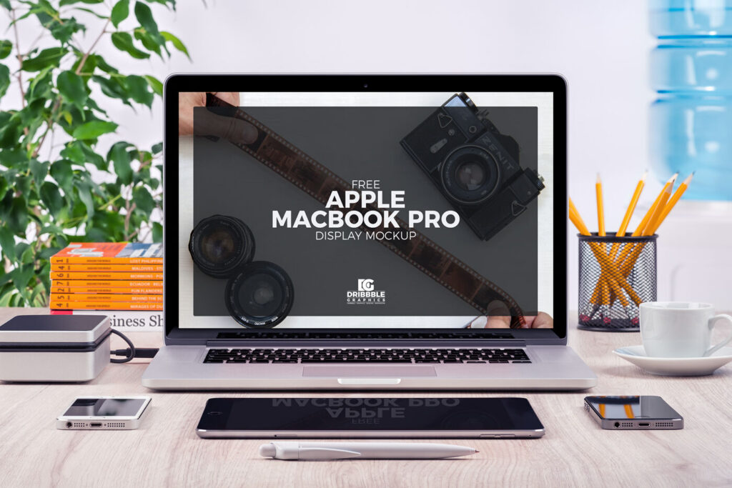 Front View of MacBook Pro and Stationery Items Mockup