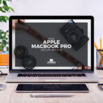 Front View of MacBook Pro and Stationery Items Mockup