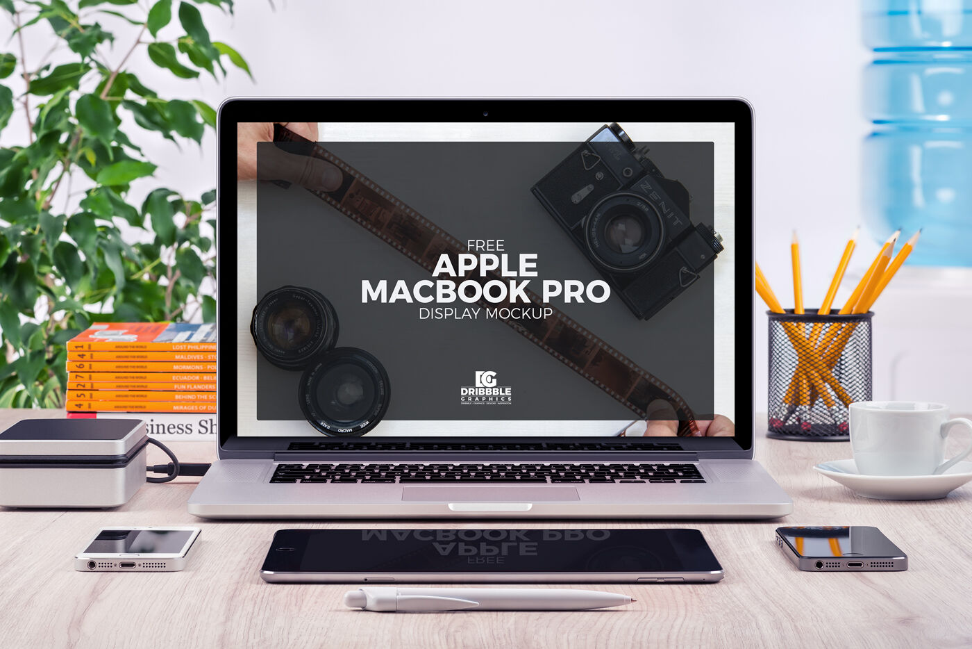 Front View of MacBook Pro and Stationery Items Mockup FREE PSD