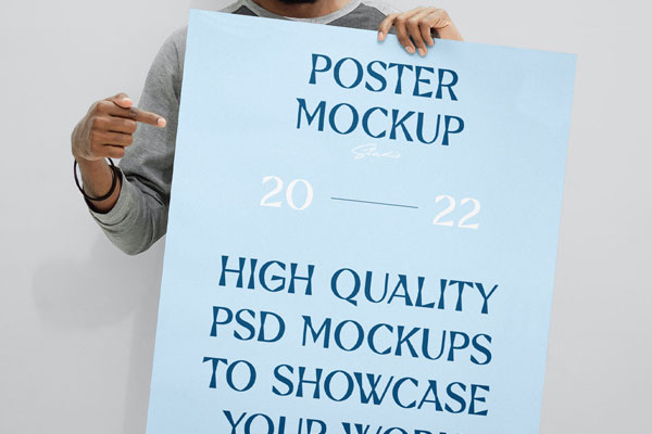Front View of Man Holding Huge Poster Mockup