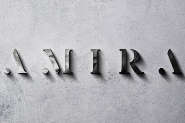 Front View of Polished Metal Sign Mockup on a Rough Wall