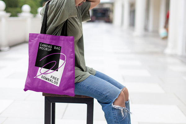 Front View of Realistic Canvas Bag Mockup with Women