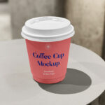 Front View of Small Coffee Cup Mockup on Table