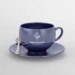 Front View of Tea Cup Mockup Featuring Saucer and Silver Spoon