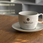 Front View of Tea Cup Mockup on Wooden Desk