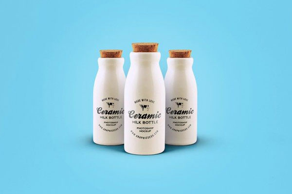 Front View of Three Ceramic Milk Bottles Mockup with Cork Lids