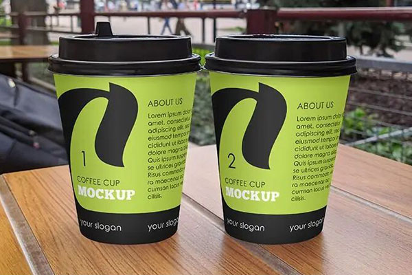 Front View of Two Matte Coffee Cups Mockup on a Modern Café Table
