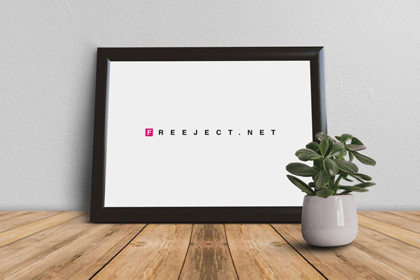 Front View Picture Frame on Wooden Table with Small Plant Mockup