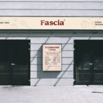 Front View Storefront Fascia Signage With Poster Mockup