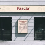 Front View Storefront Fascia Signage With Poster Mockup