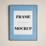 Front View Vertical Frame Hanging on Wall Mockup