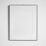 Front View Vertical Frame Hanging on Wall Mockup