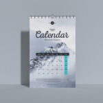 Front View Vertical Wall Calendar Mockup Standing Against the Wall