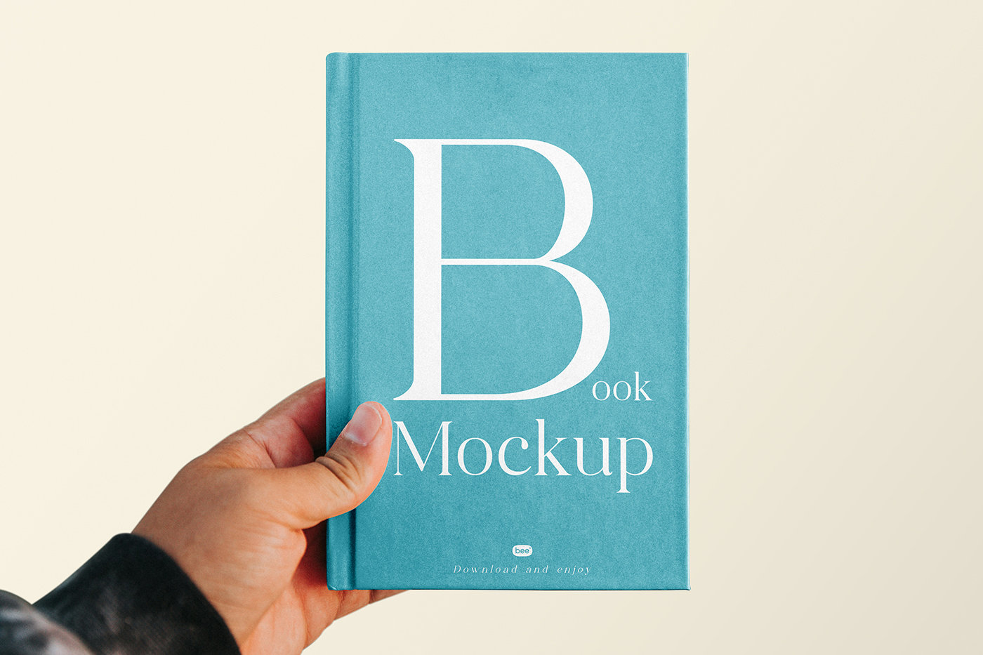 Front Vision of Book Cover Mockup in Hand FREE PSD