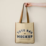 Front Vision of Hand Holding Tote Bag Mockup