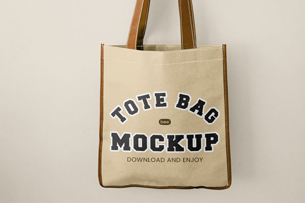 Front Vision of Hand Holding Tote Bag Mockup