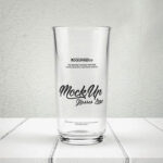 Full/Empty Glass of Water on a Wooden Surface Mockup