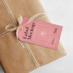 Gift Card Mockup Hung From Wrapped Package in Top View
