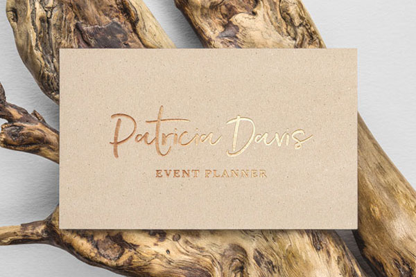 Gold Foil Effect Business Card on a Wood Branch Mockup