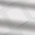 Grid of Flyers Placed on the Surface in Overhead View Mockup