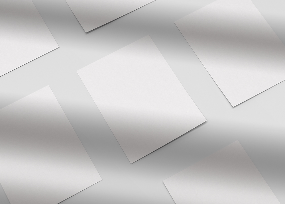 Grid of Flyers Placed on the Surface in Overhead View Mockup