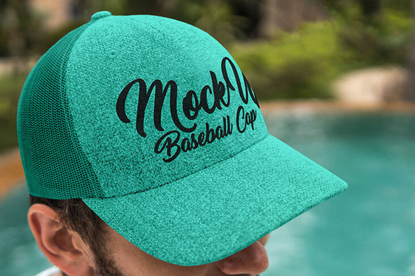 Guy Wearing a Baseball Cap by a Pool Side Mockup