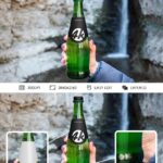 Hand Holding a Long Neck Glass Bottle Mockup