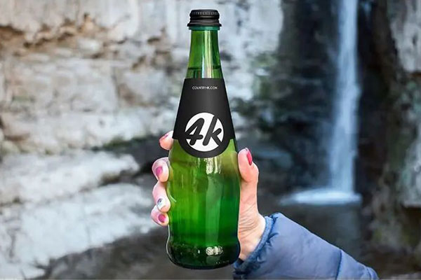 Hand Holding a Long Neck Glass Bottle Mockup