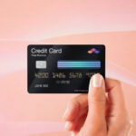 Hand Holding Credit Card Mockup in Front View