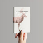 Hand Holding Hardcover Book Mockup