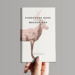 Hand Holding Hardcover Book Mockup