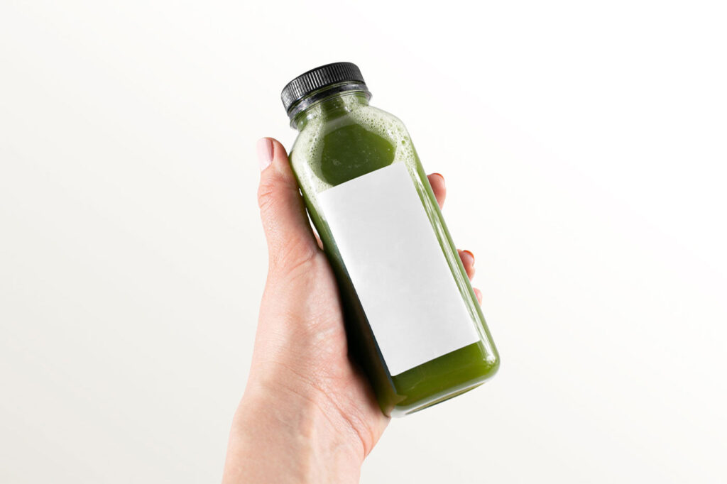 Hand-holding Healthy Bottle Mockup