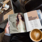 Hand Holding Open Magazine Mockup