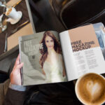 Hand Holding Open Magazine Mockup