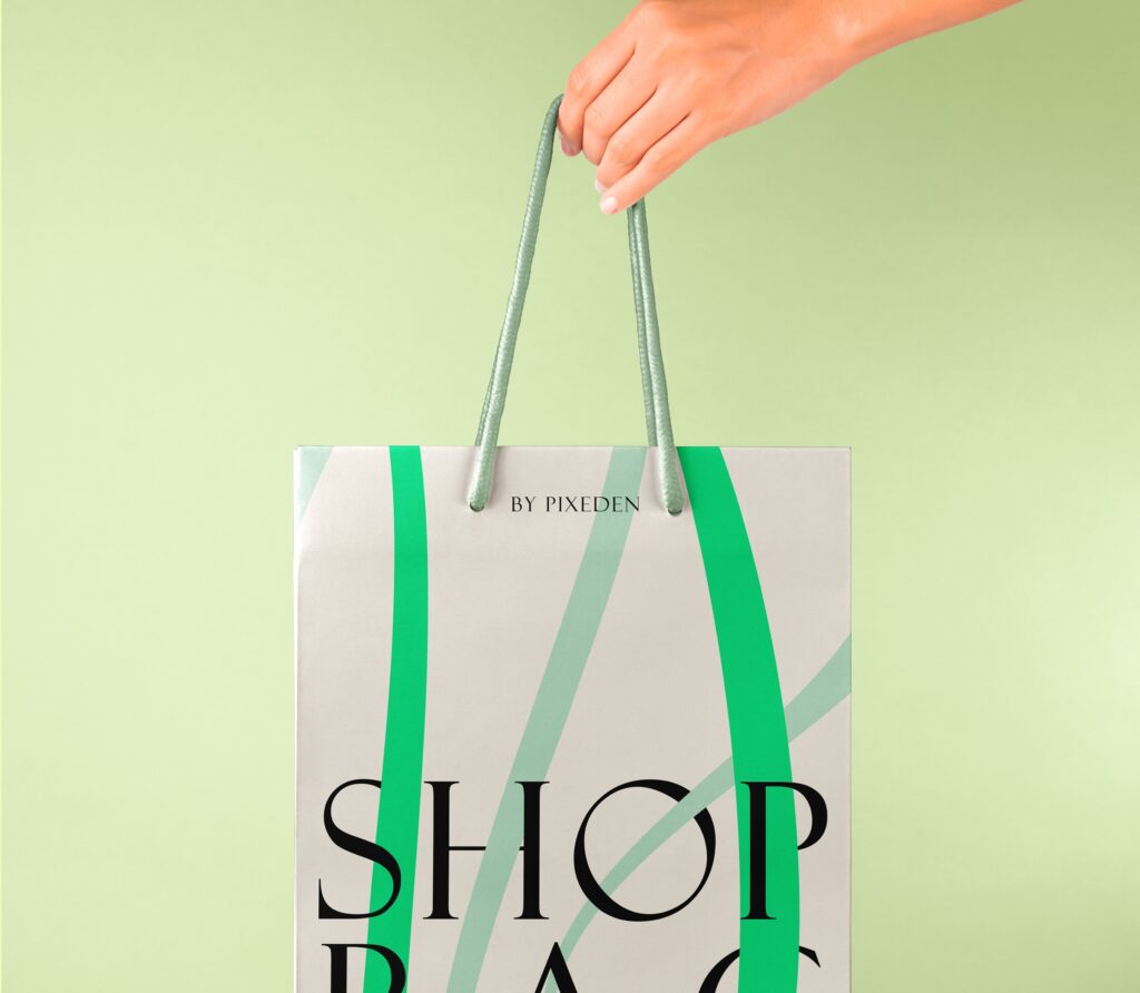 Hand Holding Paper Bag Mockup in Close-up Sight