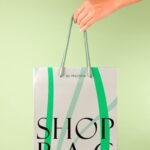 Hand Holding Paper Bag Mockup in Close-up Sight