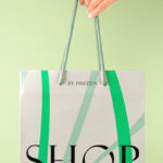 Hand Holding Paper Bag Mockup in Close-up Sight